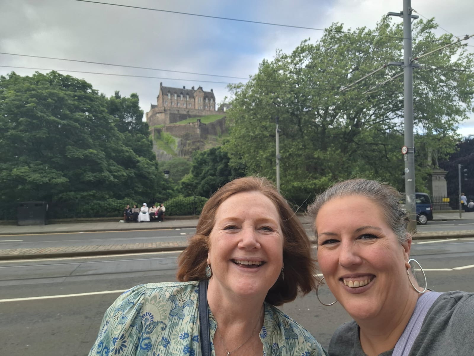 Executive Director, Julie and Administrator, Amanda walk past Edinburgh Castle